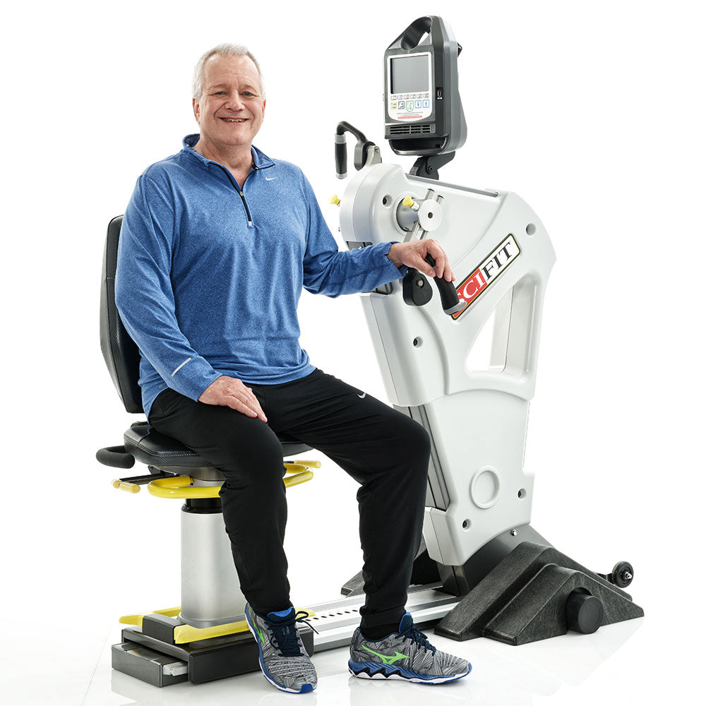 Man sitting on SCIFIT machine