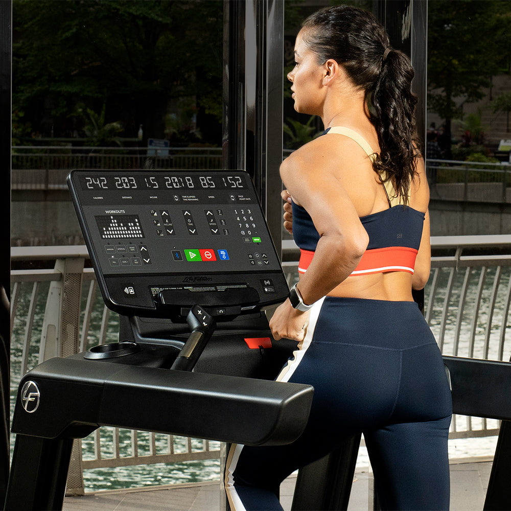 Woman Running on Life Fitness Treadmill