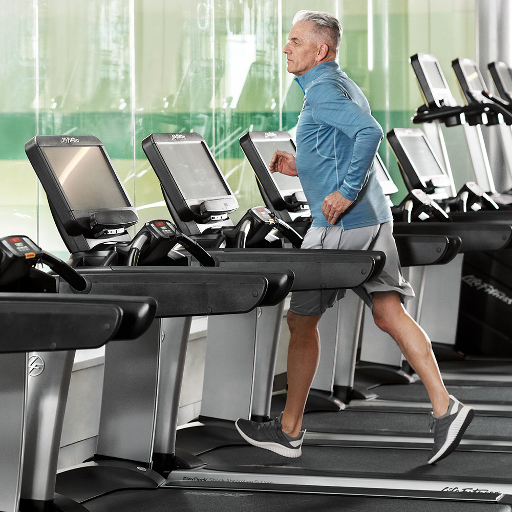 Exerciser running on Life Fitness Commercial Treadmill