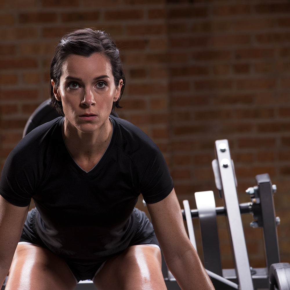 Female using Hammer Strength Squat Lunge