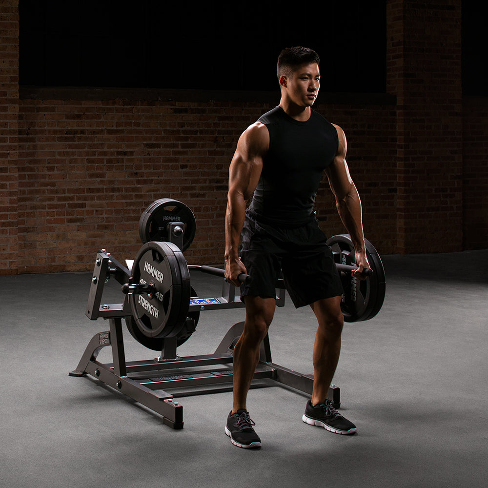 Hammer Strength Squat Lunge, male exerciser deadlifting