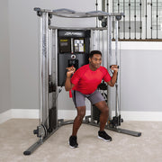 G7 Home Gym With Optional Bench, man doing cable exercises squat pressing, at home