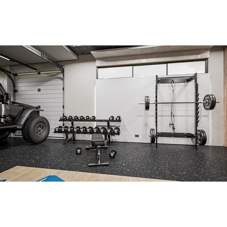 Hammer Strength Home Squat Rack in garage setting next to Jeep Wrangler