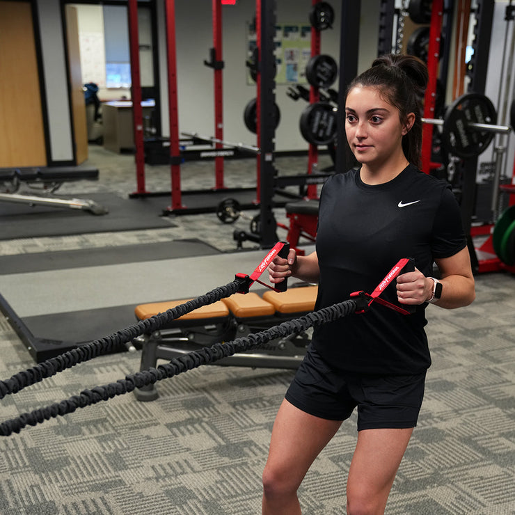 Exerciser pulling with resistance tube, using handles