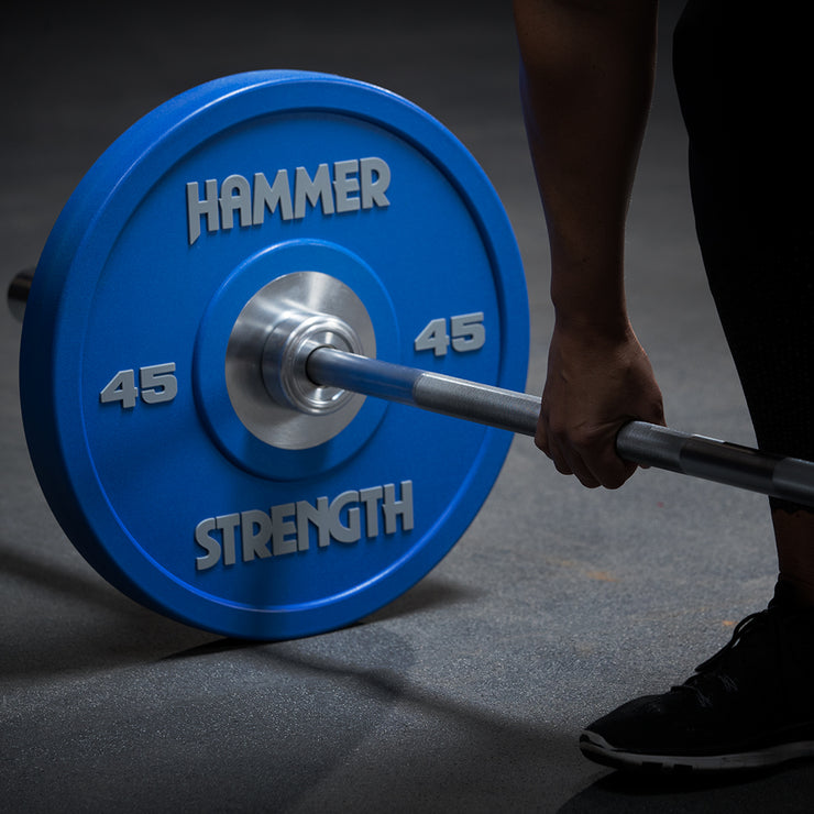 Exercising deadlifting with Hammer Strength Bar