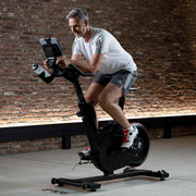 Man exercising at home on IC5 Indoor Cycle