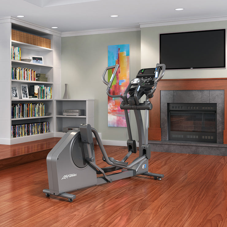 E3 Elliptical Cross-Trainer in household setting in front of fireplace