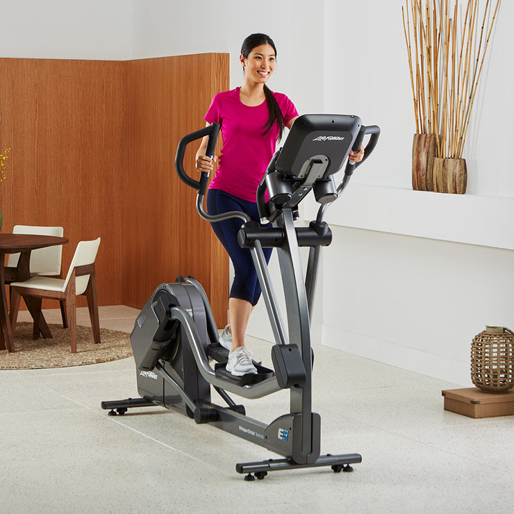 Woman exercising at home on E5 Elliptical Cross-Trainer