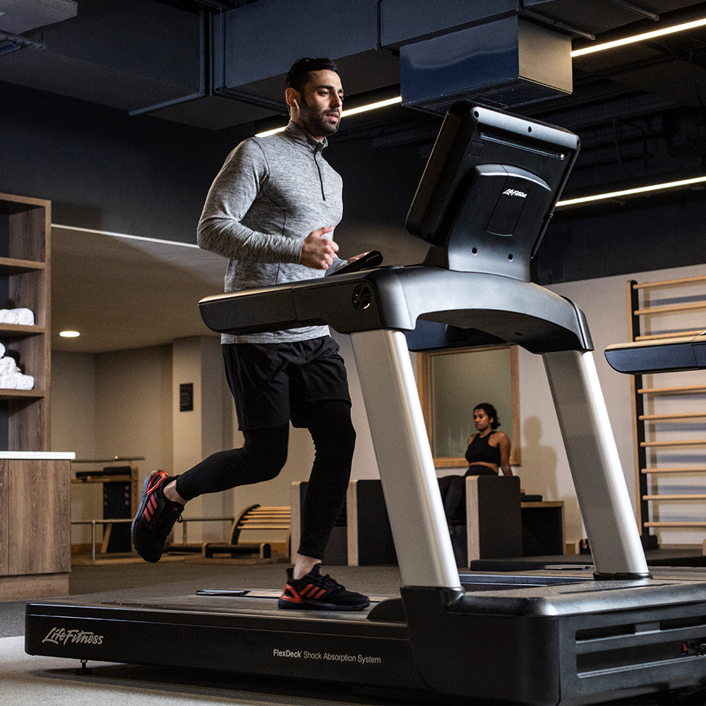 Man running on Life Fitness Integrity Treadmill at gym