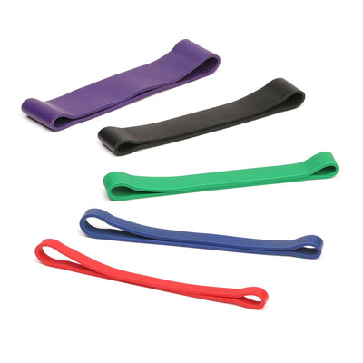 mini resistance bands laid out by thickness: purple, black, green, blue, red
