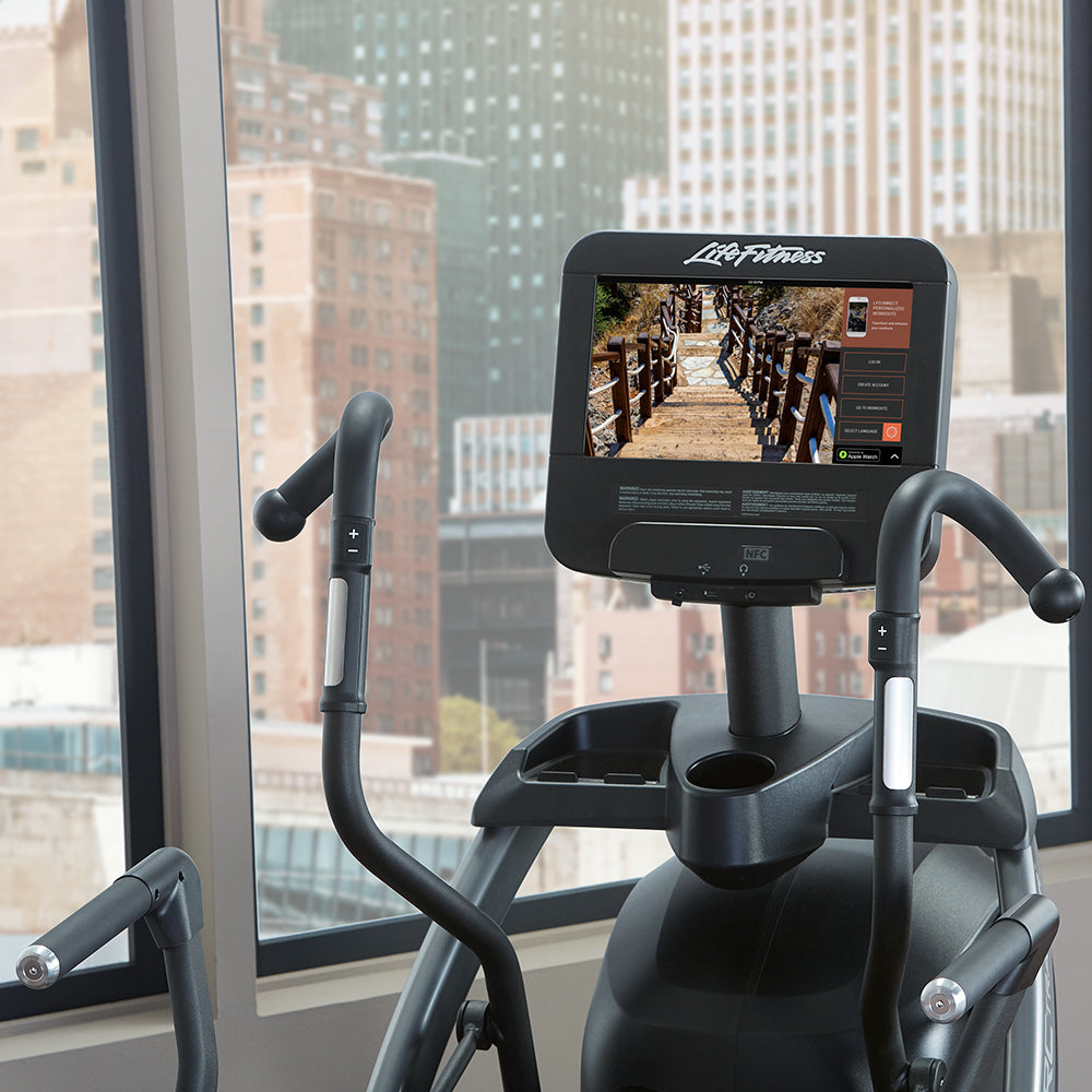 Life Fitness Arc Trainer touchscreen in highrise city apartment